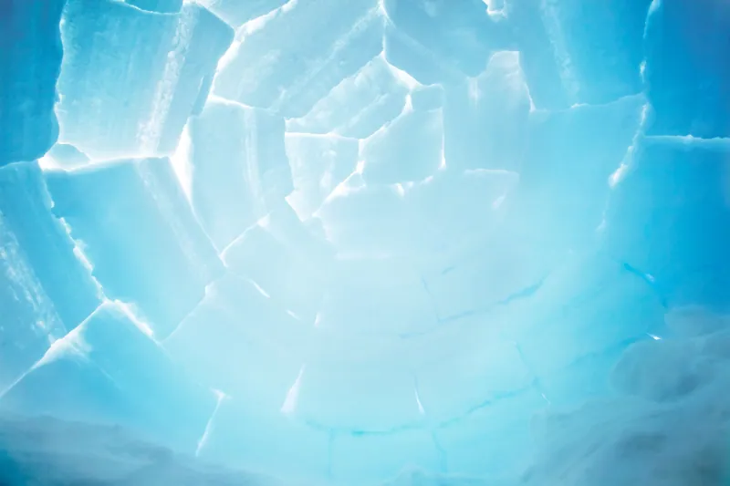 Close-up of cracked blue and white ice surface